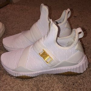 PUMA Defy Mid Varsity Sneakers.